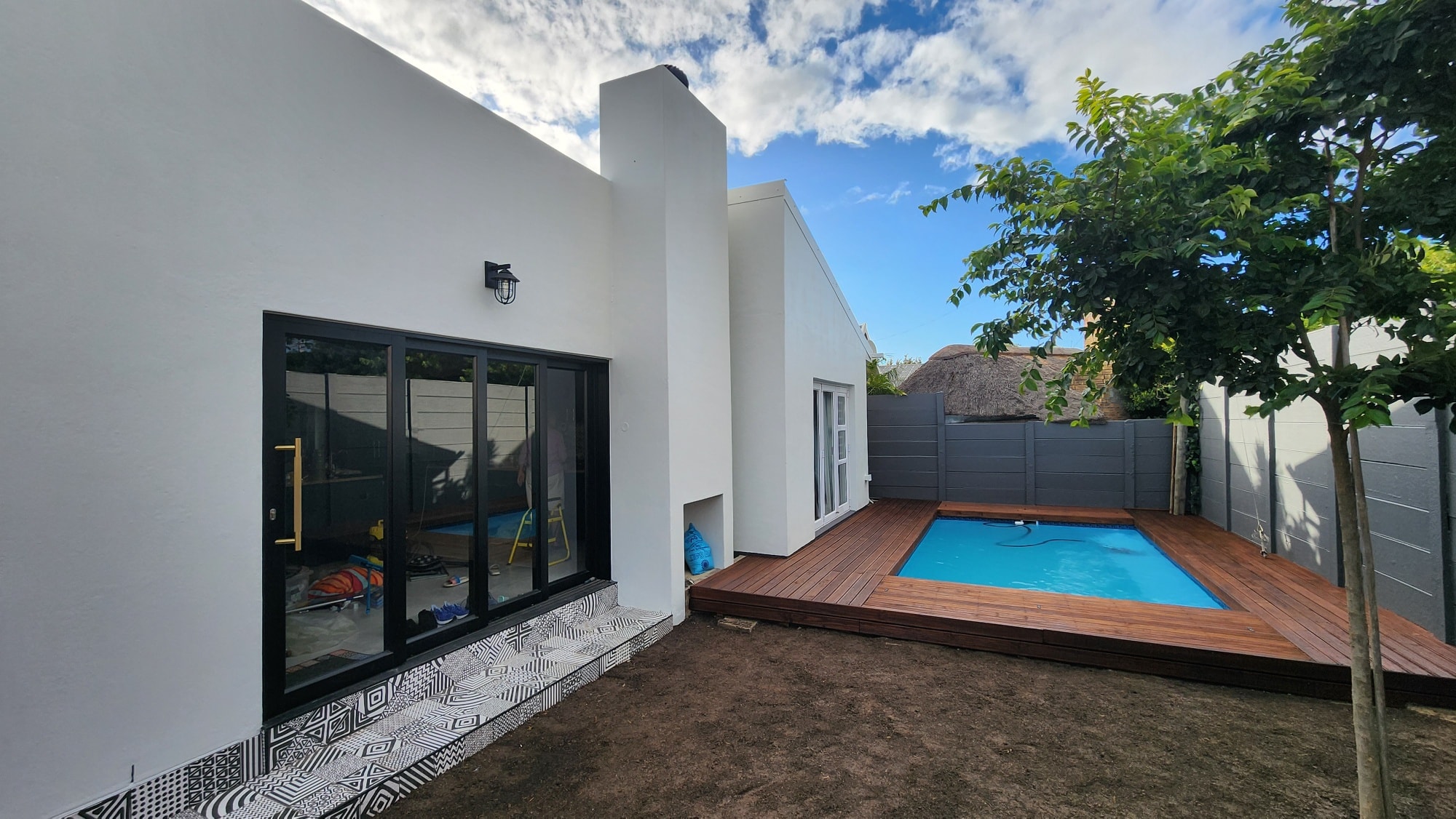 Modern home with swimming pool and wooden deck in Helderberg